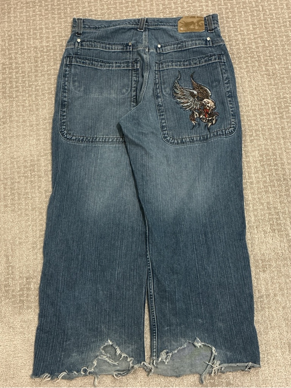 Vintage 85 JNCO double pocket winged skulls.